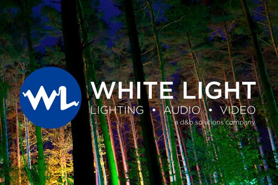 The image is of some trees lit up at night. With the title "White Light" over the top. Underneath White Light has the words "Lighting, Audio, Video." Underneath that is: "a d&b solutions company"